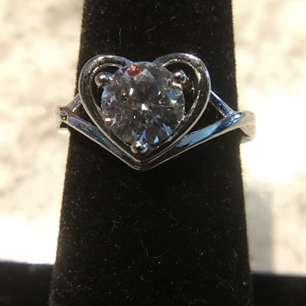 1 CT Moissanite with heart halo.
